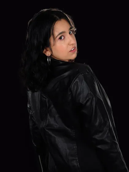 A different angle from the leather jacket photoshoot. My style is a mix of modern, youthful, and a little bit of rock and roll.