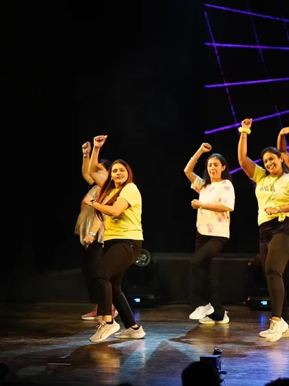 Pure joy and energy from our ladies' Zumba performance. Every member gets a chance to feel like a star.