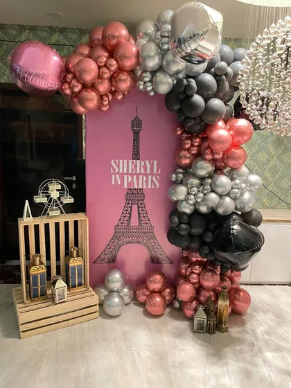 Another angle of the Paris-themed balloon decor, showing the mix of chrome, metallic, and foil balloons that bring the theme to life right in your home.
