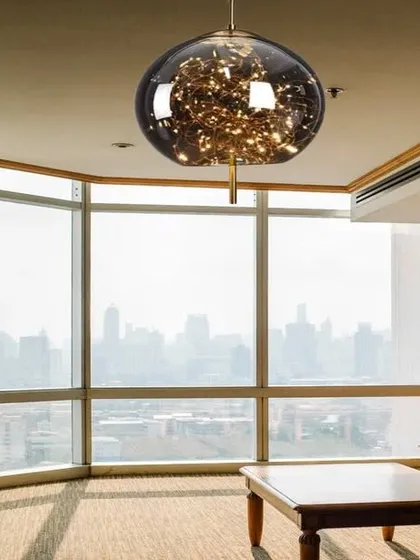 This crystal glass globe hanging light is filled with LED fairy lights, creating a magical, starry effect. The antique copper finish adds a touch of warmth, making it a stunning centerpiece for any room.