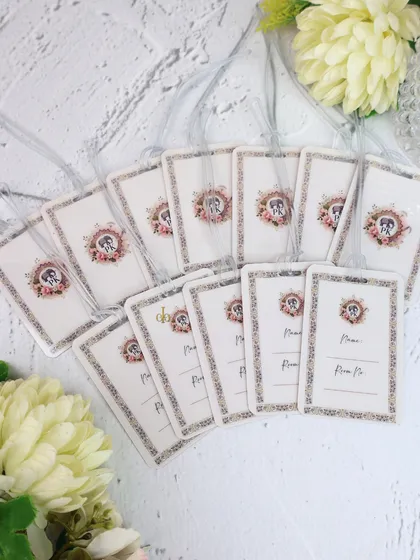 We also create custom luggage tags for wedding guests or as part of a destination wedding welcome kit. These feature the same floral crest design for a cohesive look.