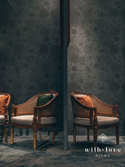 A view between two seating areas, showing the consistent use of classic furniture and art throughout the space. The design is cohesive and thoughtfully executed.