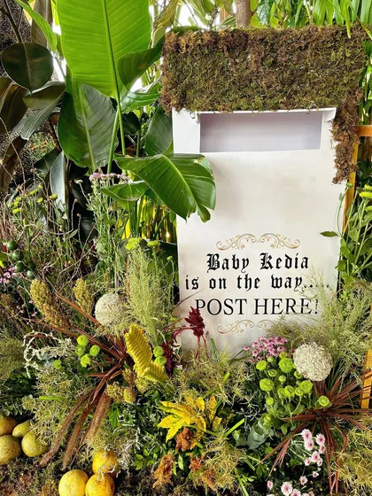 A close-up of the 'Baby Kedia is on the way' mailbox, a creative way to collect cards and well wishes.