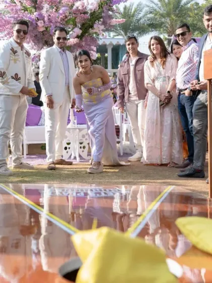 I believe in creating an experience, not just an event. This includes fun, interactive games and activities at daytime functions, like this 'drop the sand' game, to keep guests entertained.