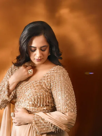 A detailed shot focusing on the craftsmanship of the embellished top and the elegant jewellery pairing for Spruha Varad's awards night.