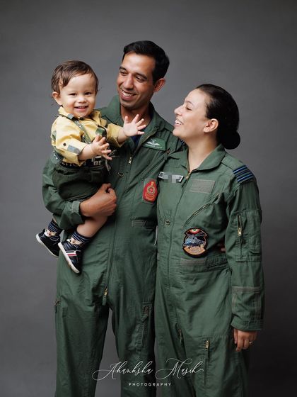 A duplicate of the candid family interaction, this image continues to showcase the genuine love and connection within this special family.