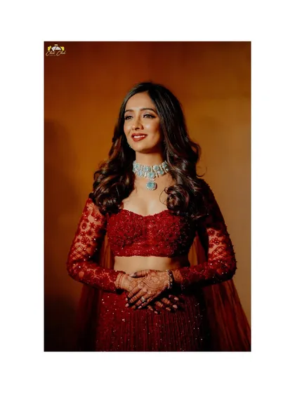 A close-up bridal portrait showcasing her stunning jewelry and joyful expression.