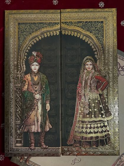 I designed this card with a gate-fold opening that reveals the bride and groom, framed by an ornate archway reminiscent of a palace entrance.