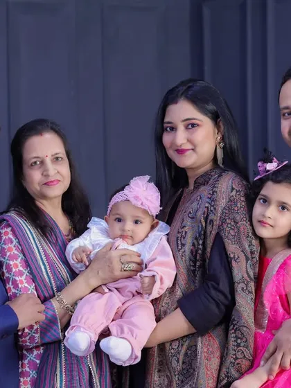 Grandparents, parents, and children all together. I love the mix of generations and the proud smiles on everyone's faces as they hold the youngest members of the family.