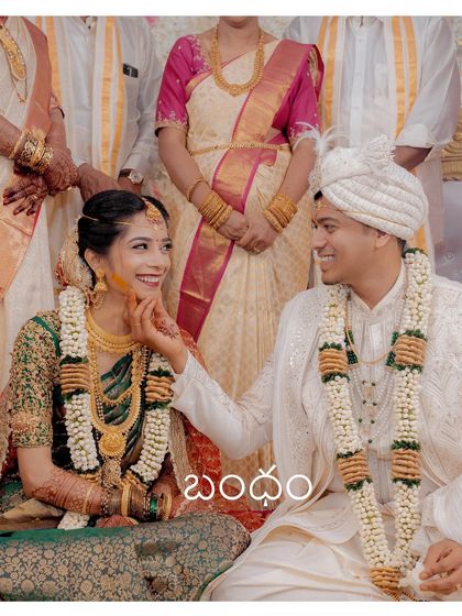 A playful and loving touch during the ceremony. This candid shot captures the couple's chemistry and the joy they find in each other's company.