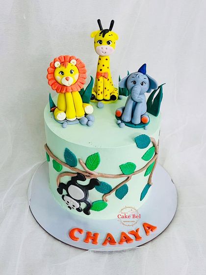 A third angle of the cute jungle animal cake.