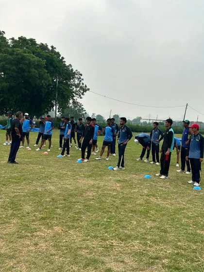 A group of players listening intently during a fitness drill. We train as a unit.