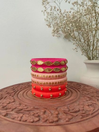 A beautiful set of bangles in shades of pink and red. I used different techniques here, including gota patti and simple beadwork, to create a varied and interesting stack.