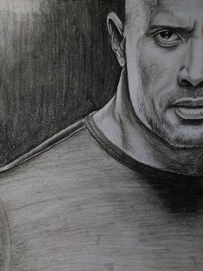A charcoal pencil portrait of "The Rock" Dwayne Johnson. I used heavy shading to capture his powerful physique and intense, focused look.