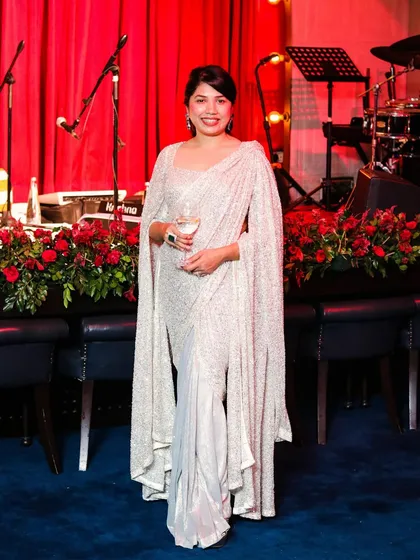Blending modern style with timeless grace. I designed this custom silver drape saree with dramatic accentuated sleeves for a client who wanted to shine at her cocktail event.