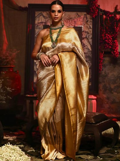 A vision in gold. This shot for Soho Begum captures the luxurious sheen and drape of a pure silk golden saree.