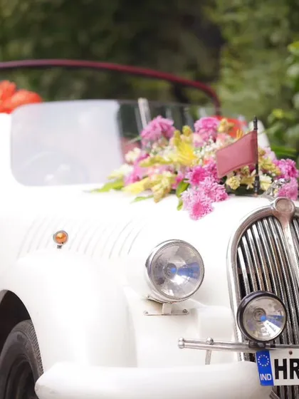 The perfect getaway car. A beautifully decorated vintage car adds a touch of classic romance and makes for a fantastic photo opportunity.