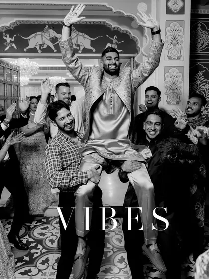 The sheer energy and excitement of the groom's sangeet entrance. Lifted on the shoulders of his friends, this black and white photo perfectly freezes a moment of high-spirited celebration, showcasing our ability to capture candid wedding fun.