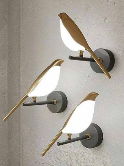 A set of charming bird-shaped wall lights. These playful yet elegant fixtures are perfect for adding a touch of whimsy to any room.