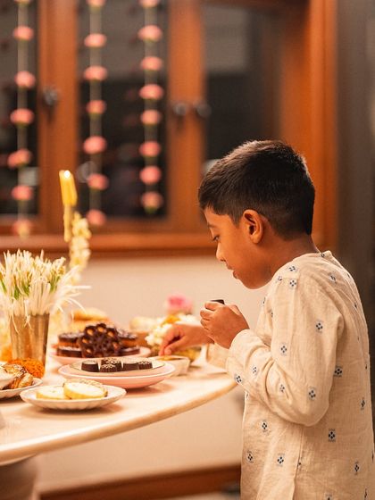 Our littlest and most honest critic, Ari, getting ready to sample the Diwali treats. His approval means everything.