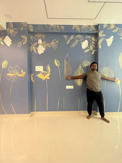Here I am with another gold foil creation. The design on the dusty blue wall is elegant and fills the large space with artistic flair. The client was thrilled with the outcome!