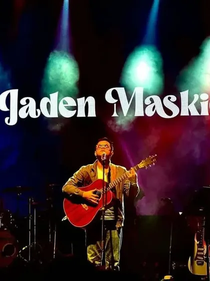 A great shot from our Mumbai show at Market City. The colorful stage lights and my guitar create a classic singer-songwriter concert image.