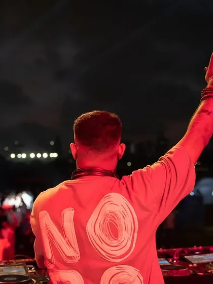 A shot of me pointing to the sky, a signature move to build energy and connect with the crowd.