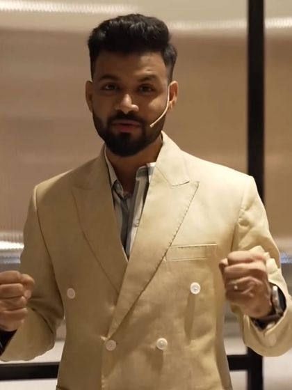 A client looking confident and ready for his presentation in a beige double-breasted linen blazer.