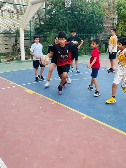 A player looks to make a pass while being defended. We focus on making smart, quick decisions with the ball.