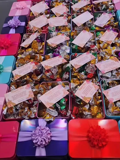 These colorful tin boxes filled with assorted chocolates are a fantastic budget-friendly option for kids' birthday parties. Each box comes with a personalized thank you card.