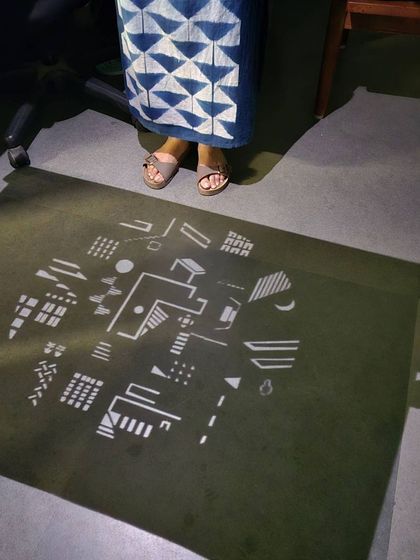 Vidya Ruparelia's artwork for Playfield 1SR, projected onto the gallery floor. Her piece abstracts architectural elements of 1 Shanthi Road into a dynamic composition, exploring the idea of filling a cosmic void with form and meaning.