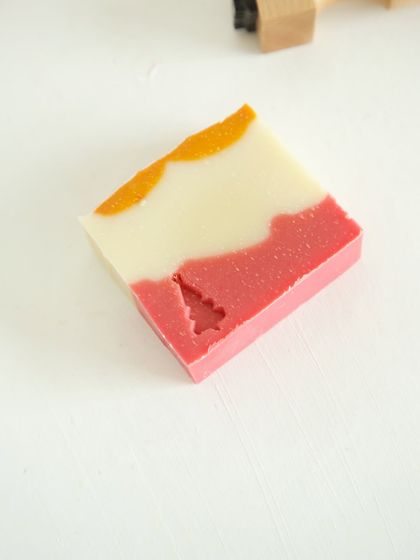 A single bar of 'Herbal Revival' soap with a Christmas tree stamp.