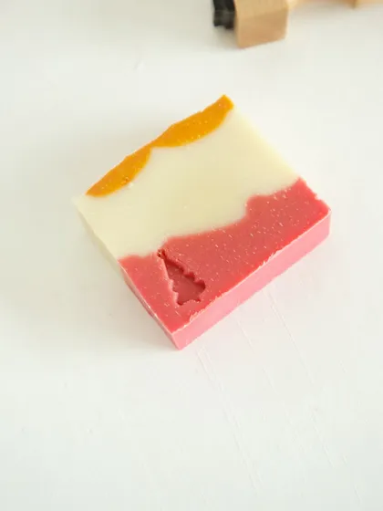 A single bar of 'Herbal Revival' soap with a Christmas tree stamp.
