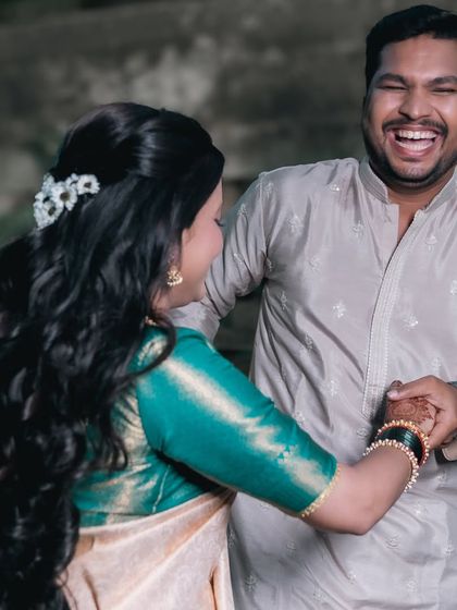 A playful moment captured during their pre-wedding session. The groom's hearty laugh shows the fun and relaxed atmosphere we create during our shoots.