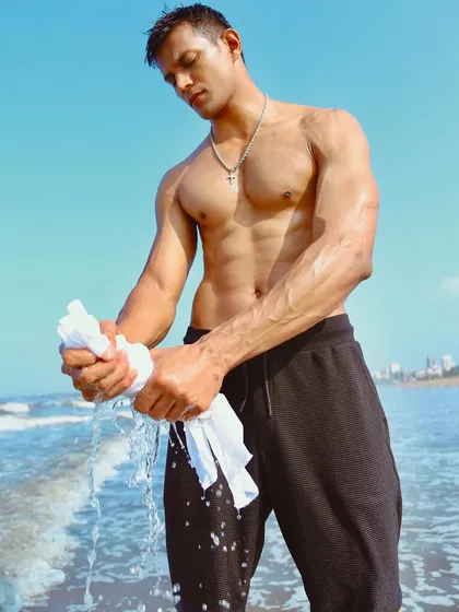 A powerful shot from a men's fitness and lifestyle portfolio on the beach. I work with models to create authentic, dynamic images that are perfect for brand lookbooks and commercial use.