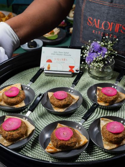 Here are my Kala Channa Kebabs served on a Malabar Parantha with pickled onion. This is a unique and flavorful vegetarian appetizer that is always a crowd-pleaser.