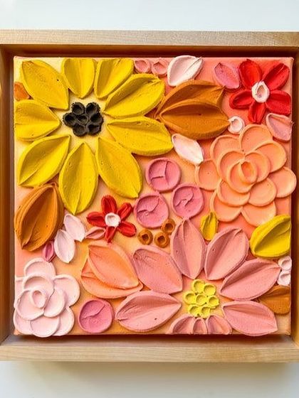A finished and framed floral texture painting. The warm color palette and variety of flower shapes create a cheerful and vibrant piece of art.