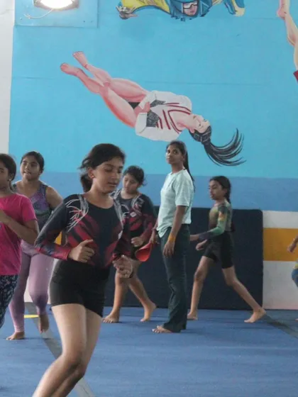 A candid shot of our gymnasts during a training session. The energy and enthusiasm in the gym are always contagious.