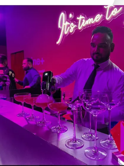 Our mixologist using a foam dispenser to add the finishing touch to cocktails at the innovative HSBC launch event.
