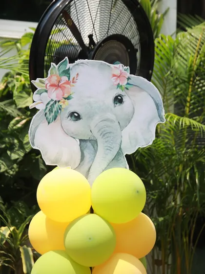 It's all in the details. A cute elephant cutout on a balloon pillar adds a sweet touch to the jungle decorations.