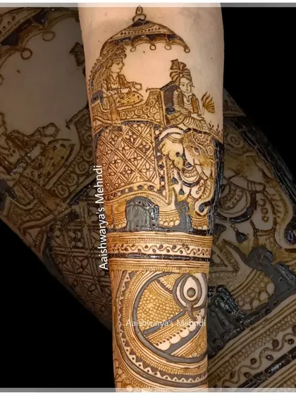 A close-up of the royal procession scene from a bridal arm design, with the bride and groom seated on a decorated elephant.
