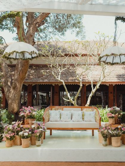 A centered shot of the beautiful and understated Mehendi stage, perfectly blending with the natural charm of the Goan venue.