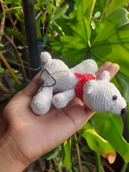 Here's a version of the polar bear keychain with a little red scarf for a pop of color. All my creations can be customized with accessories like this.