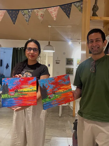 This couple worked side-by-side to create a vibrant landscape painting. It's a fantastic date activity that is both relaxing and rewarding.
