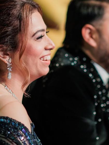 A candid shot of the happy couple watching the performances. Their smiles say it all. This is the reward for all the hard work during rehearsals.