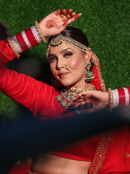 A beautiful, classic bridal pose. The makeup is elegant and timeless.