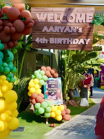 A personalized welcome sign and balloon arrangement for a Lion King themed birthday. Every party starts with a warm, customized greeting for the guests.