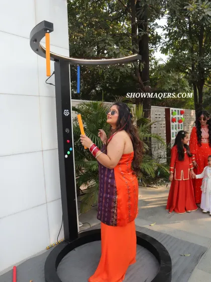 A guest enjoys playing the interactive light game at the poolside Haldi event.