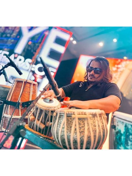 The intricate rhythms of the tabla being perfected before the audience arrives.
