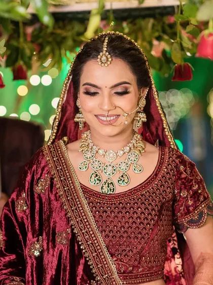 Shubhangi's wedding photos. I created a soft, romantic look with a messy braided bun and flawless makeup that lasted all night.